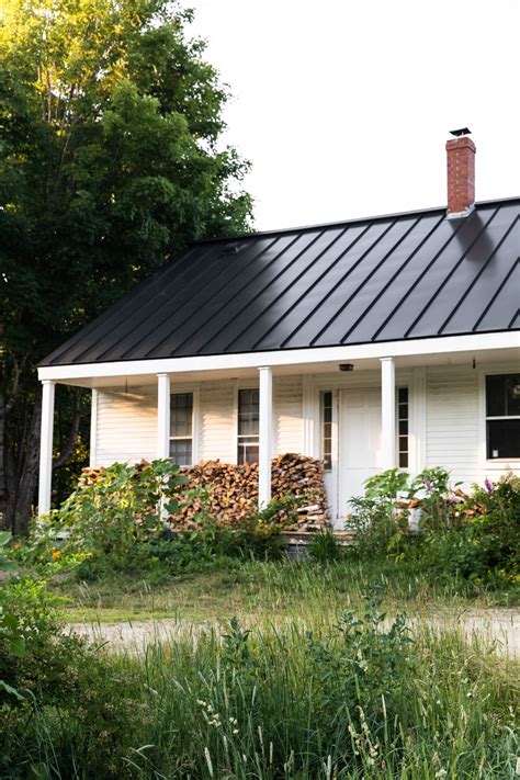 black and white metal house|houses with white metal roofs.